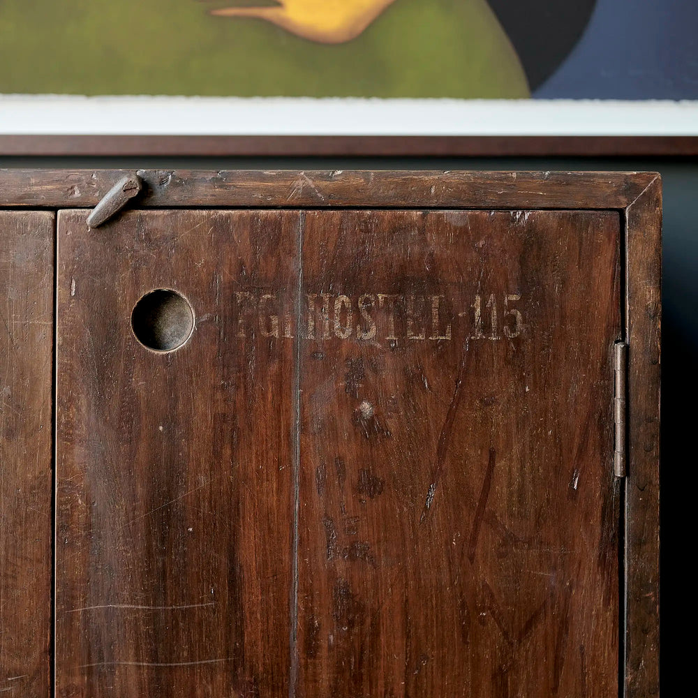 Lemieux et Cie Pierre Jeanneret teak cabinet - close-up of the PG HOSTEL 115 stencil, a recessed circular pull and the original wooden toggle latch