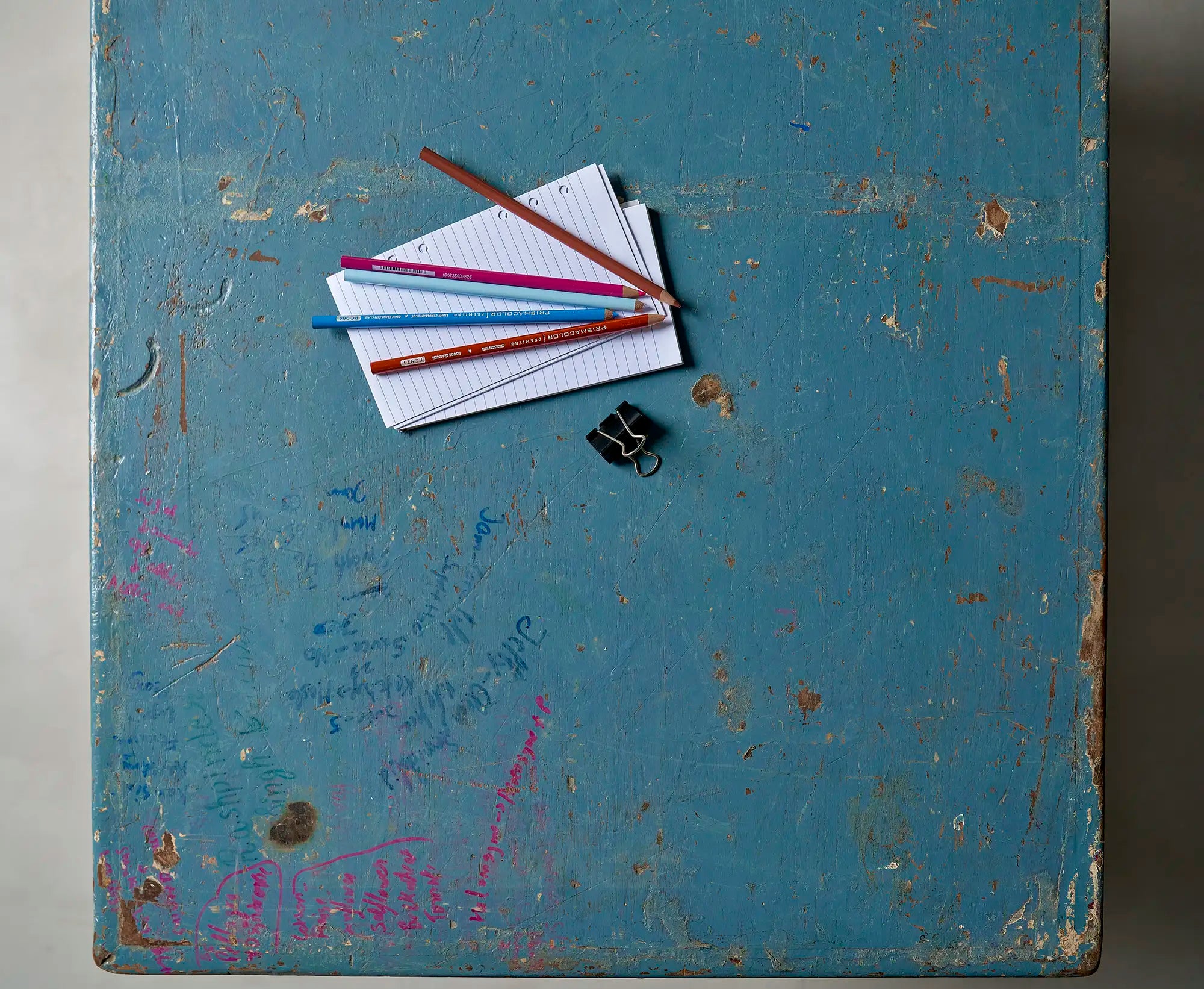 Lemieux et Cie Pierre Jeanneret X-leg student desk with original blue painted top - overhead view of the blue painted top styled with printed cards