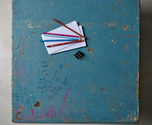 Lemieux et Cie Pierre Jeanneret X-leg student desk with original blue painted top - overhead view of the blue painted top styled with printed cards