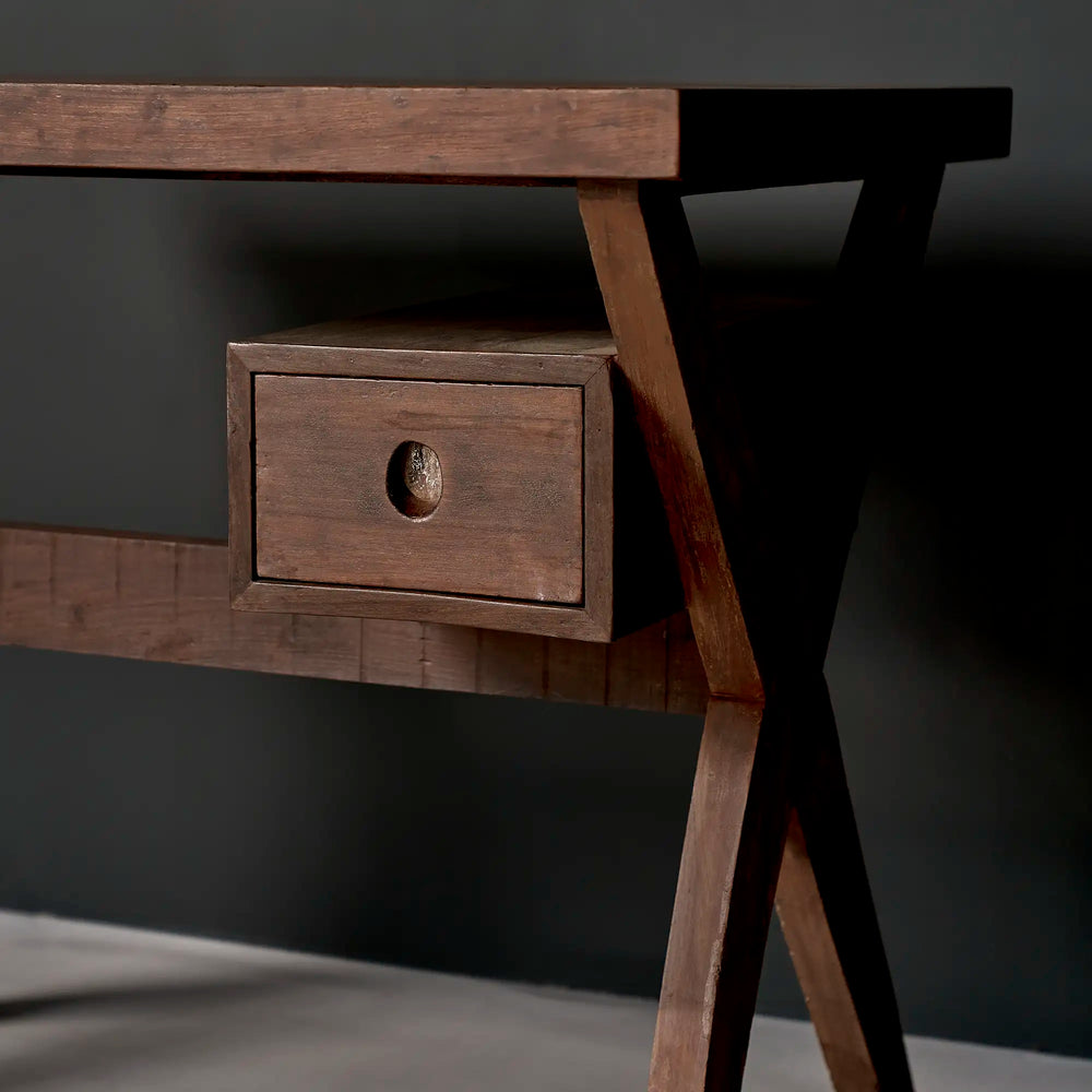 Lemieux et Cie Pierre Jeanneret writing desk in solid teak - three-quarter view of the suspended drawer with its circular cutout pull and the X-leg frame