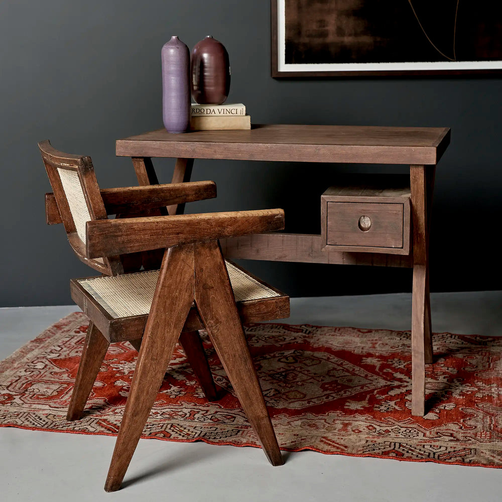 Lemieux et Cie Pierre Jeanneret writing desk in solid teak - styled wide scene with a teak armchair, books and ceramics