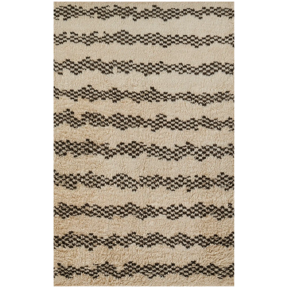 Lemieux et Cie Plivot rug in ivory and charcoal with geometric striped pattern, handwoven textured rug shown on white studio backdrop.