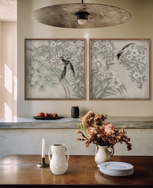 Lemieux et Cie Dax Quilt Set in cotton with geometric stitching, draped over wood dining table in warm-lit room with botanical artwork and neutral walls.