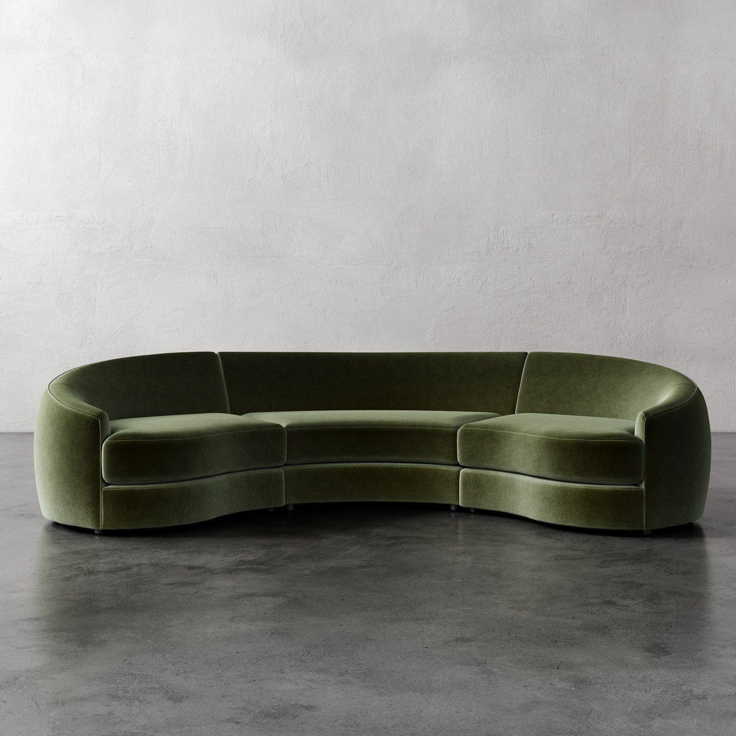Lemieux Et Cie Rulmann Rulmann 3-Piece Sectional Green curved sofa on a gray floor with a plain wall background