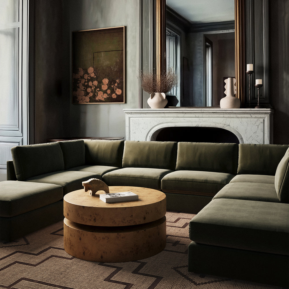 Lemieux Et Cie Chanaux 8-piece sectional sofa Modern living room with a green sectional sofa, round wooden coffee table, and decorative elements.