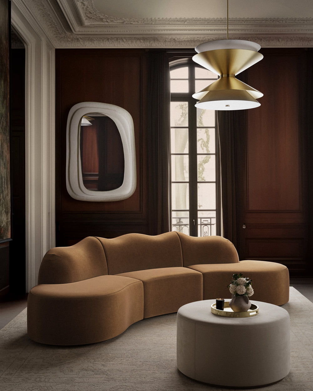 Lemieux et Cie Serpentine 3 Piece in nutmeg, curved modular sofa in a wood-paneled sitting room with ornate plaster ceiling and tall windows.