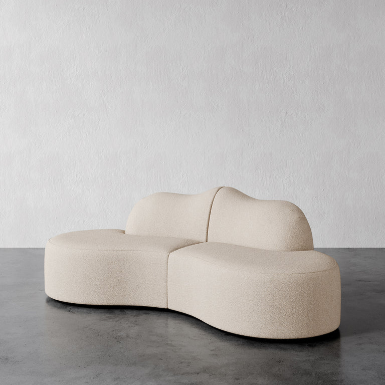 Lemieux Et Cie Serpentine 2-Piece
Beige modern sofa on a gray floor with a white wall background