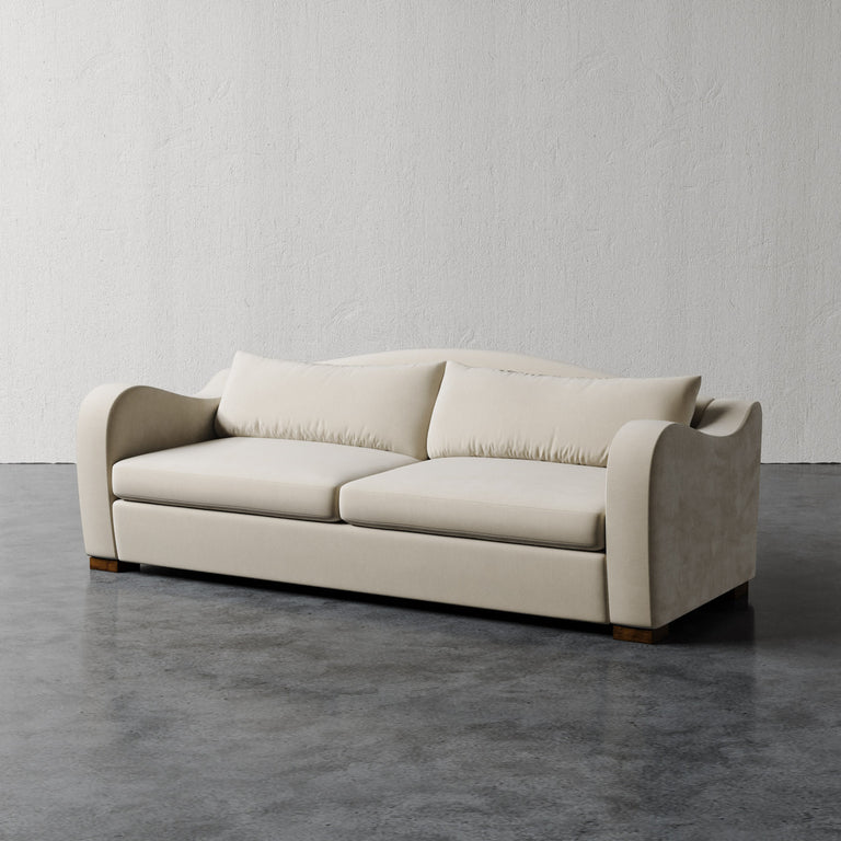 Lemieux Et Cie Elodie Sofa (Made-to-order) Beige sofa on a gray floor with a plain white wall background