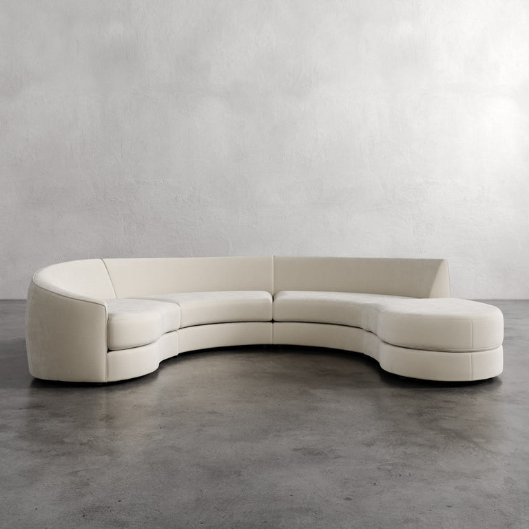 Lemieux Et Cie Rulmann 4-Piece Left Sectional Curved beige sofa against a plain wall