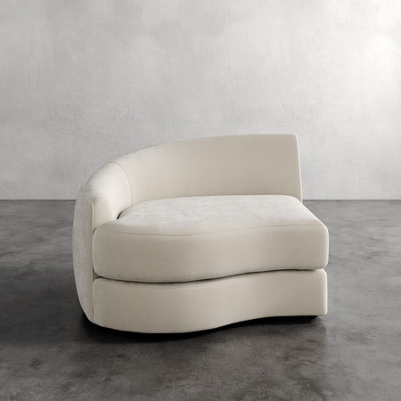 Lemieux Et Cie Rulmann Left Arm Chair Beige modern sofa on a gray floor with a white wall background