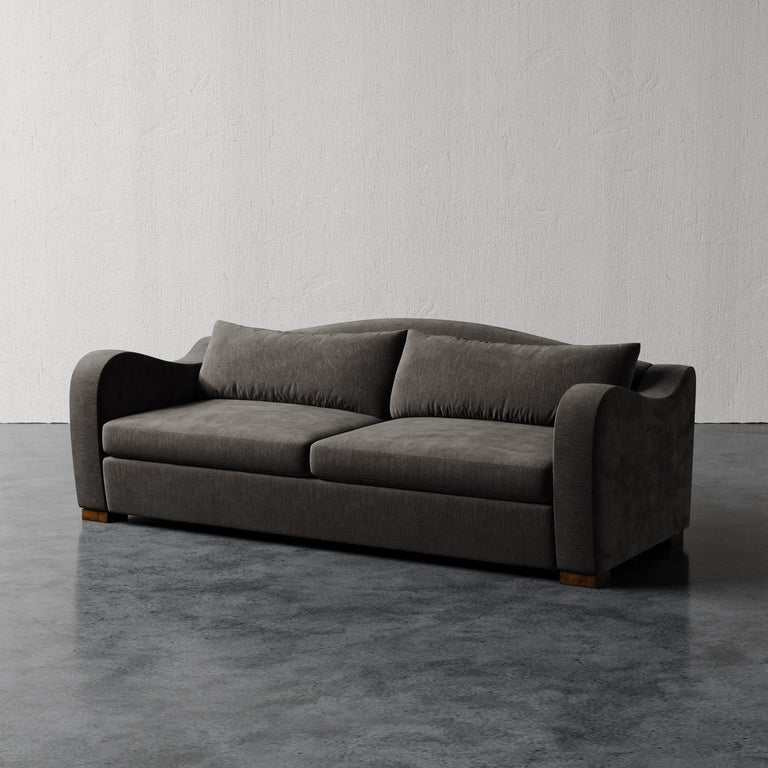 Lemieux Et Cie Elodie Sofa (Made-to-order) Gray sofa on a dark floor with a light gray wall background