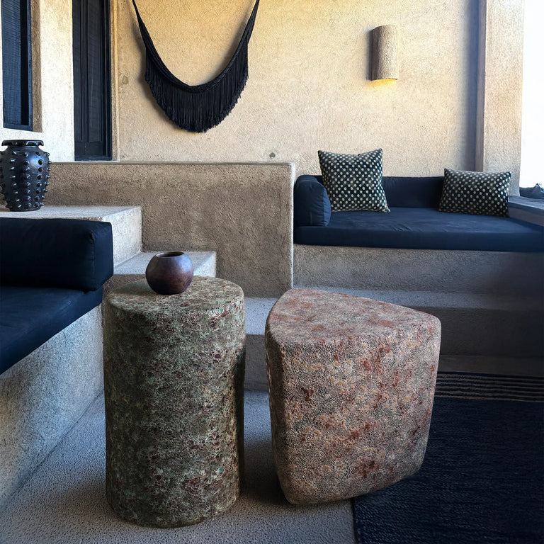 outdoor patio scene with the Enso Oxidized Jade ceramic end table and Kado Ember Ash stool with reactive glaze. Handmade for indoor and outdoor use.