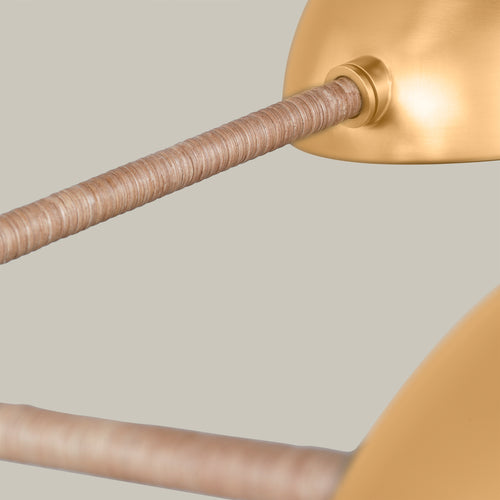 Lemieux et Cie Balleroy brass dome pendant with rattan-wrapped stem, detail shot showing hand-wrapped organic texture against neutral backdrop.