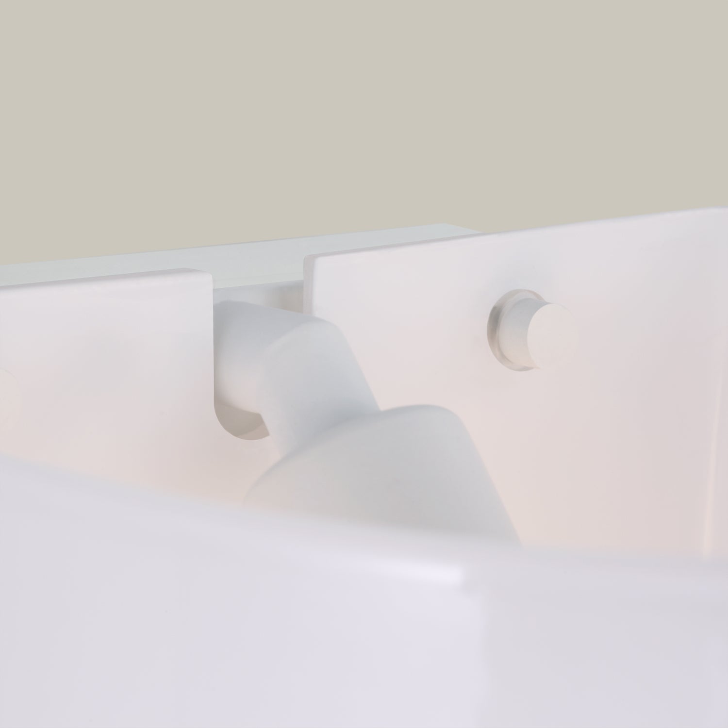 Lemieux et Cie Cheverny lighting collection in white plaster, sculptural sconce with organic curves and circular detail, shown against neutral wall