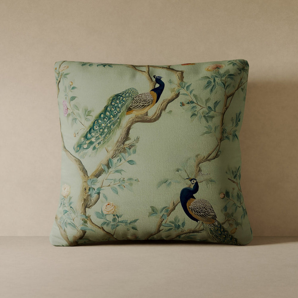 Lemieux et Cie Peacock Plume Velvet Pillow in soft sage green with hand-painted peacock motif, square decorative pillow on neutral backdrop