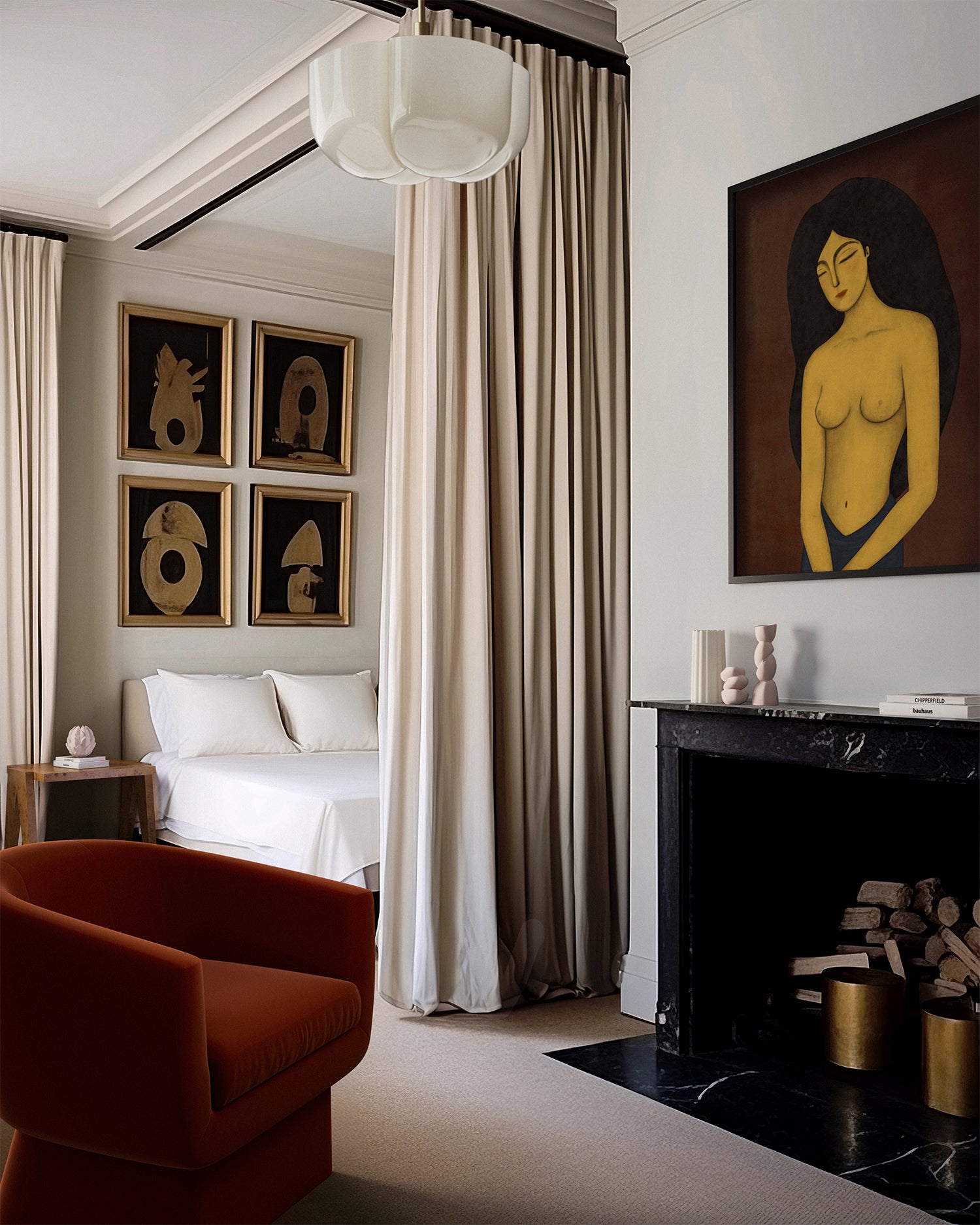 Lemieux et Cie Les Femmes Trois art print in warm tones, styled above a black marble fireplace in a bedroom with neutral walls and curated gallery art.