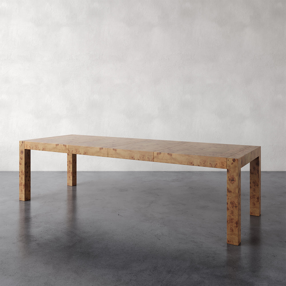Lemieux et Cie Avenir Dresser in Mappa Burl with hand-cast brass hardware, six-drawer dresser on concrete floor against neutral plaster walls.