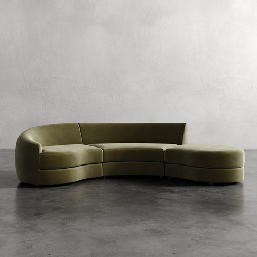 Modern olive green sofa against a plain wall. Rulmann 3-Piece Left Sectional Balsam