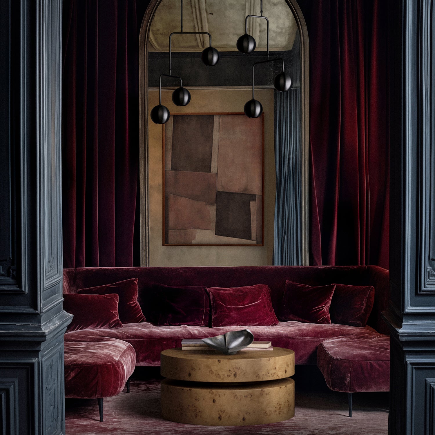 Lemieux et Cie Le Havre Limited Edition Art Print in cinnamon, blush and taupe, geometric abstract artwork shown above deep burgundy velvet sectional in room with paneled walls and arched mirror.