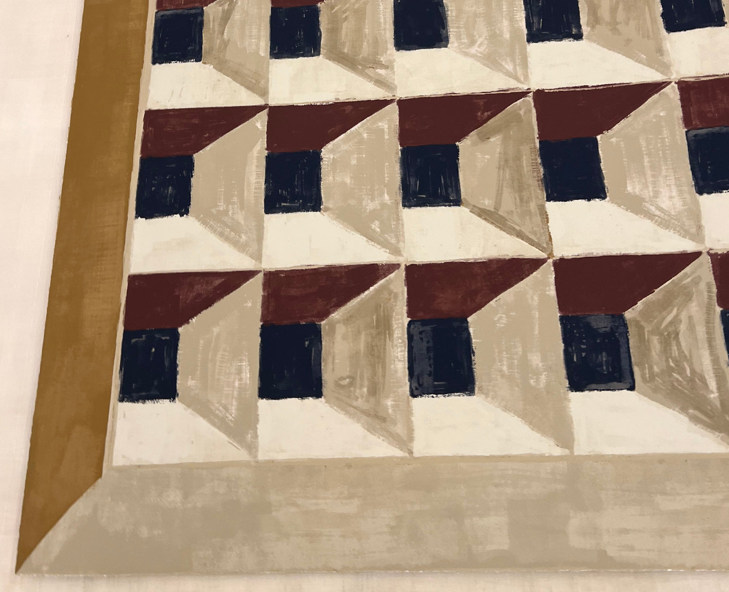 Lemieux et Cie Les Cubes 1 fine art print with geometric trompe-l'oeil pattern in navy, burgundy and tan, shown against neutral wall with warm side light