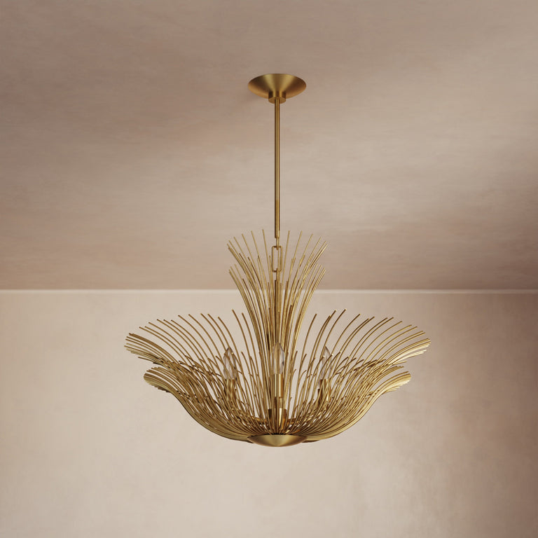 Lemieux et Cie Dorelle Chandelier, radiating sculptural form with tapered rods in warm finish, suspended in a room with neutral plaster walls and ceiling.