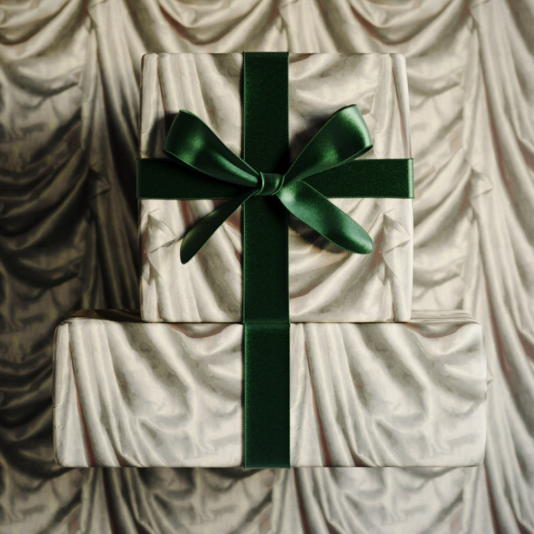 Lemieux et Cie Satin Drape premium gift wrap inspired by trompe-l'œil satin folds in soft neutral tones.