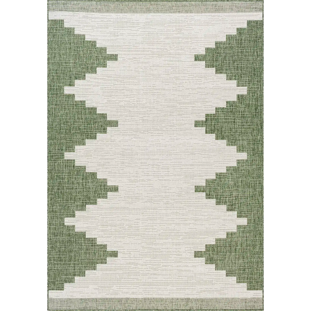 Lemieux et Cie Cottier Outdoor Rug in green and ivory, geometric border pattern with stepped edges, flatweave construction shown on white studio backdrop.