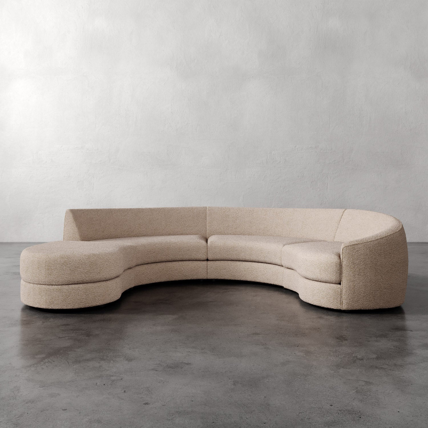 Lemieux Et Cie Rulmann 3-Piece Right Sectional Beige curved sofa on a gray floor with a plain gray wall background