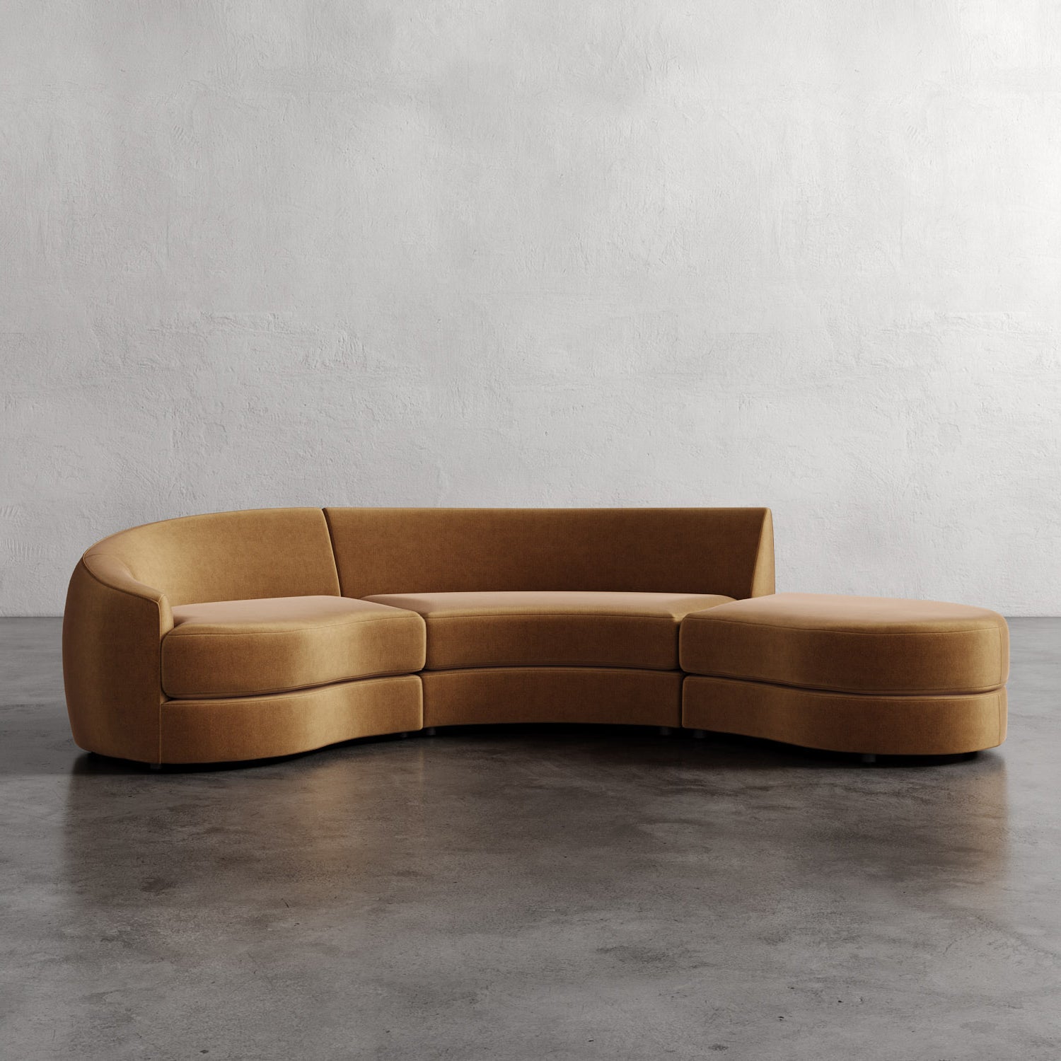 Brown curved sofa against a plain wall. Rulmann 3-Piece Left Sectional Hazelnut