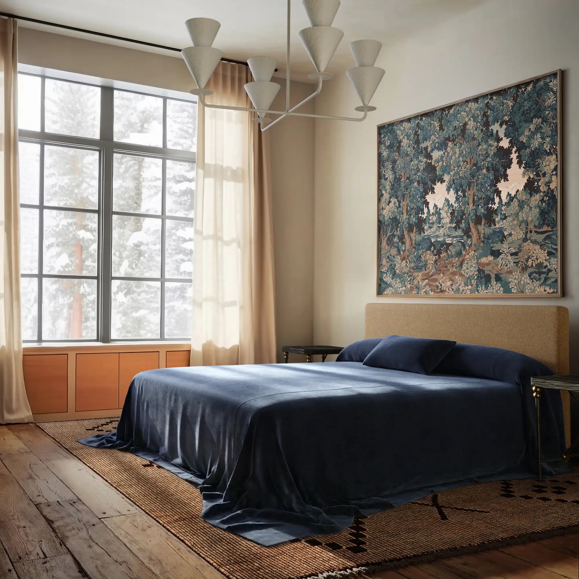 Lemieux et Cie Heavy Linen Coverlet in Indigo, draping a bed in a bedroom with wood floors, neutral walls, and soft daylight from gridded windows.