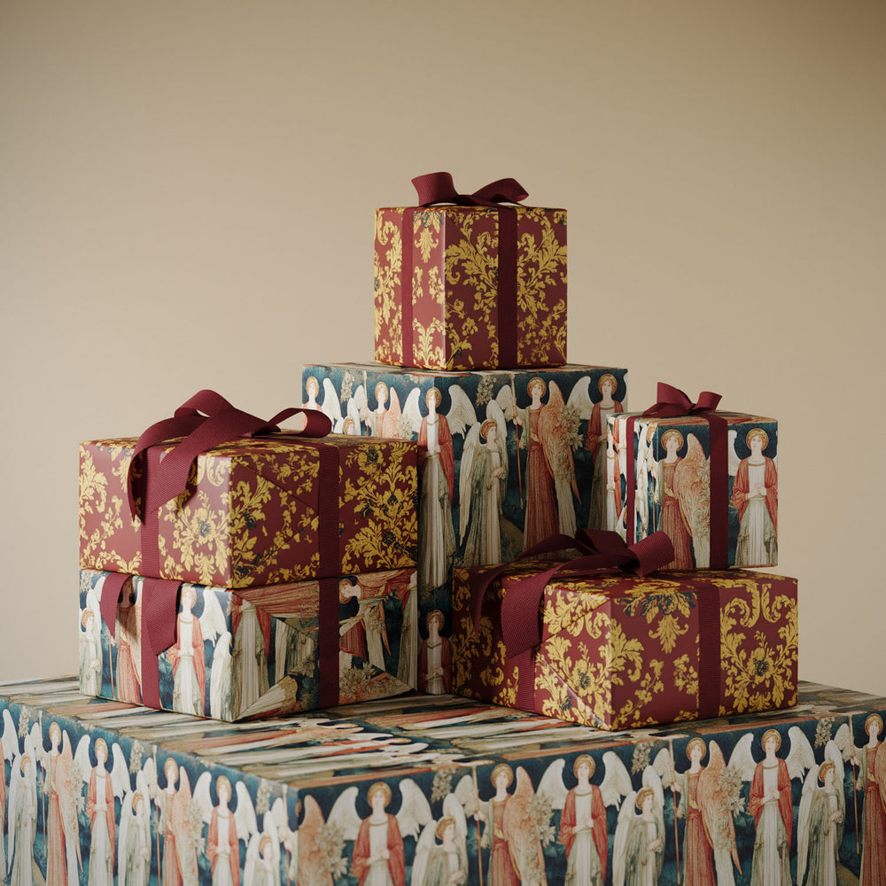 Lemieux et Cie Archangels Gift Wrapping Paper in burgundy gold damask and medieval angel motifs, decorative paper boxes stacked on neutral backdrop.
