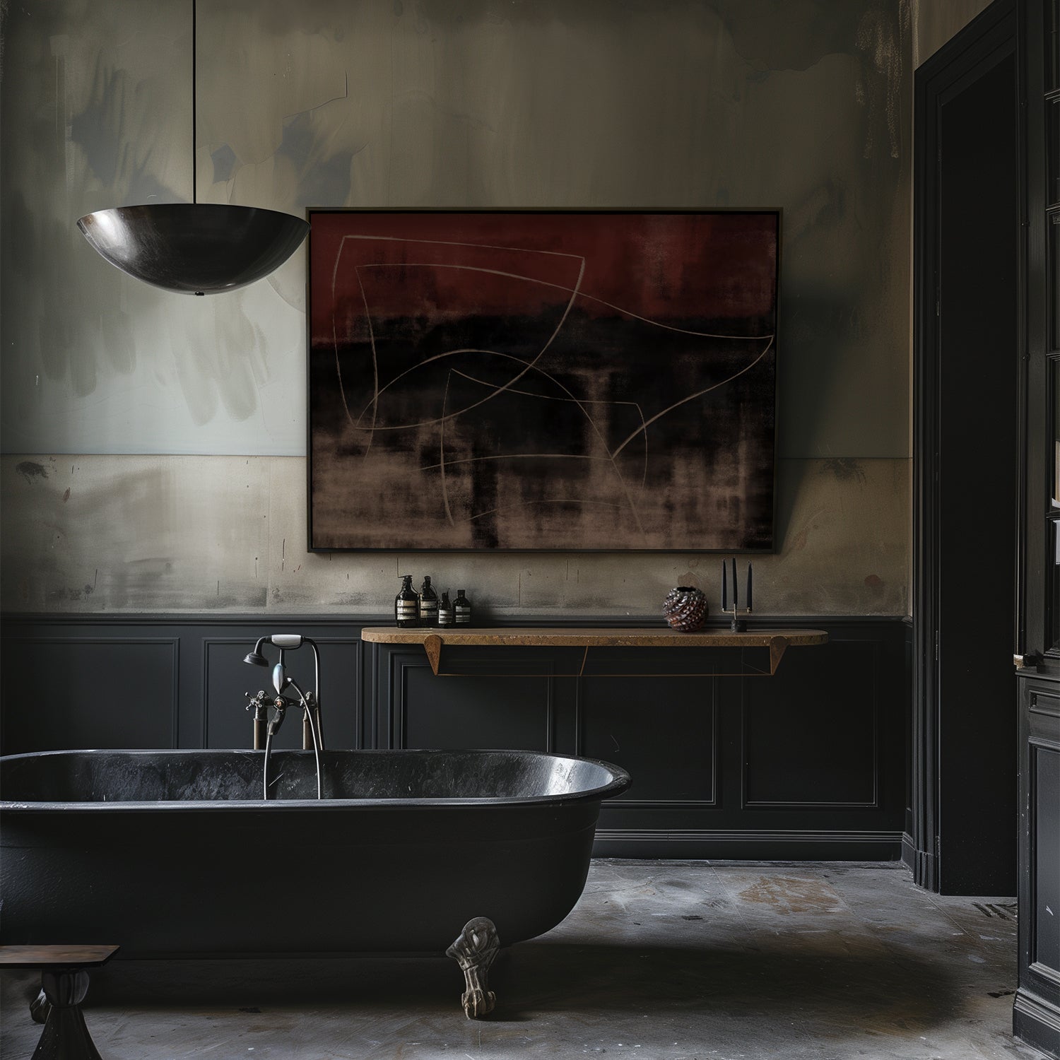 Lemieux et Cie Chambord Pendant, sculptural bowl form in dark finish, suspended above a freestanding bathtub in a plaster-walled bathroom with stone floor.