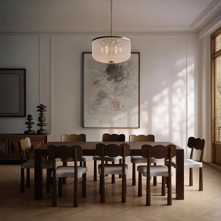 Lemieux et Cie Madeleine Dining Chair in dark oak with upholstered seat, shown in a dining room with herringbone wood floors and paneled walls.