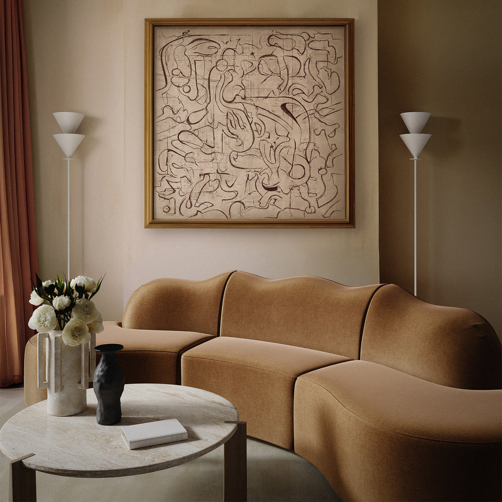 Lemieux et Cie Serpentine 3-Piece Sectional, curved sofa in warm camel, shown in a neutral sitting room with stone floor and pale walls.