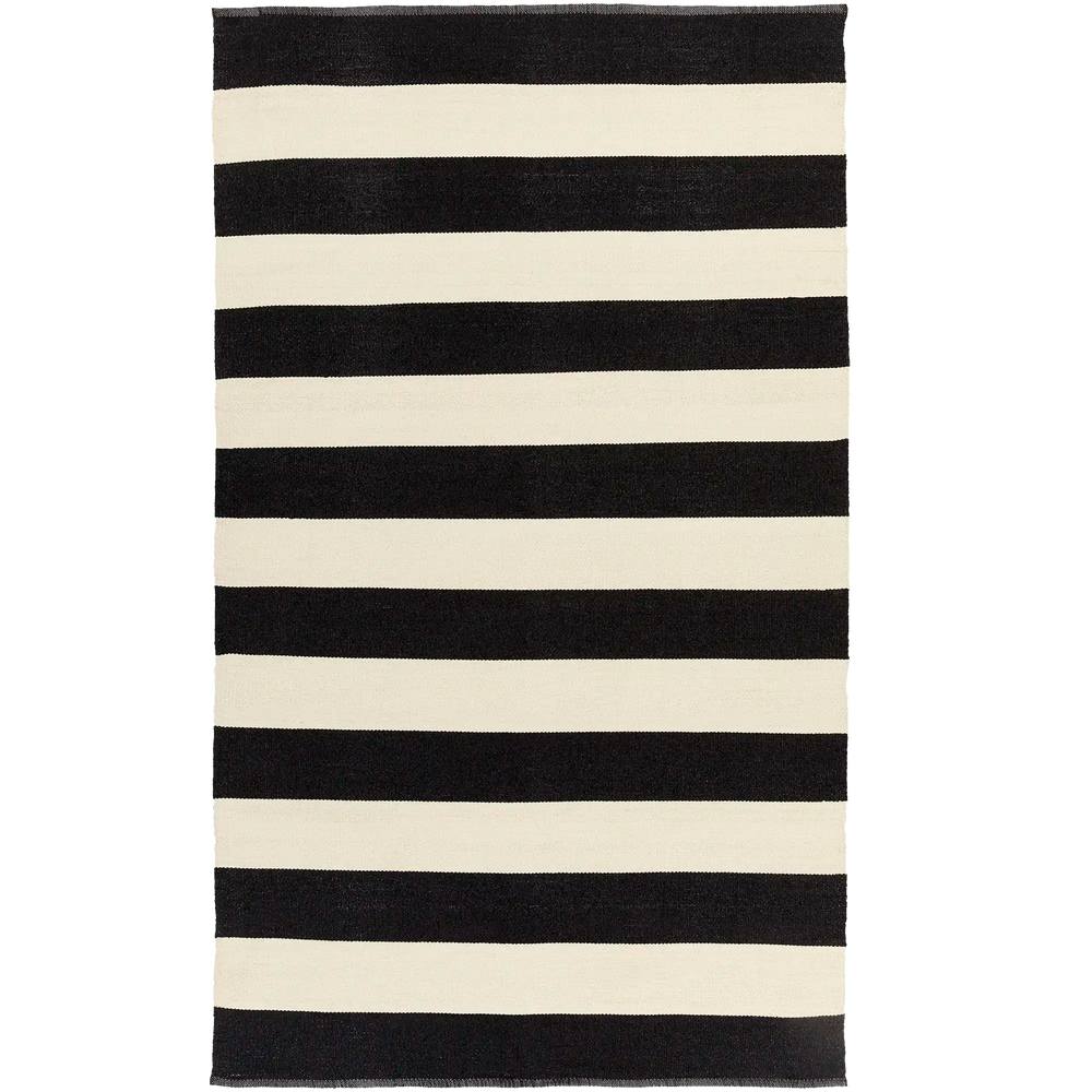 Lemieux et Cie Soraya Hand Woven Outdoor Rug in bold black and ivory horizontal stripes, flat-weave rug shown on white studio backdrop.
