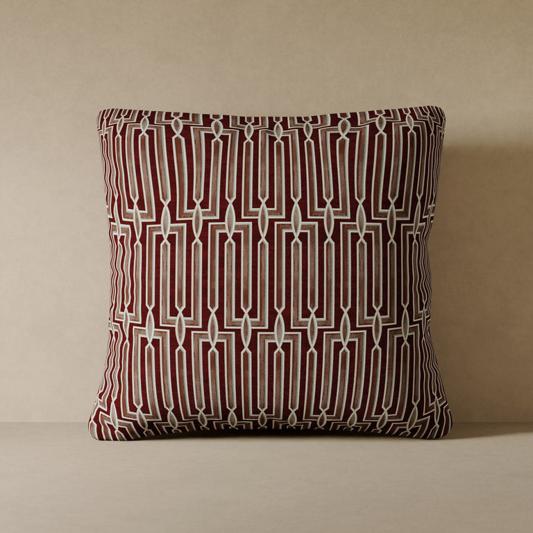Lemieux et Cie Arbus Stripe Velvet Pillow in burgundy, geometric statement pillow with interlocking linear pattern, shown on neutral backdrop.