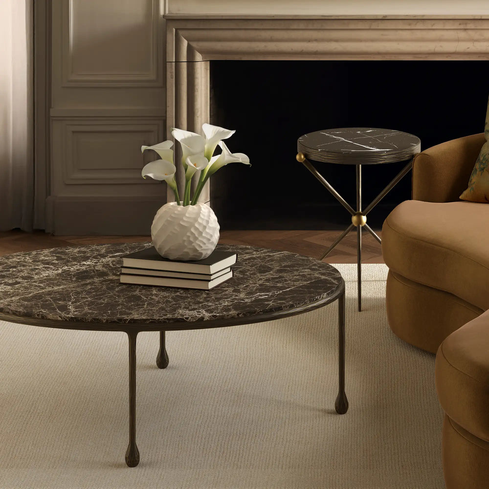 Lemieux et Cie handcrafted pinched clay vase in white, ceramic vessel with textured surface, styled on marble coffee table in sitting room with paneled walls.
