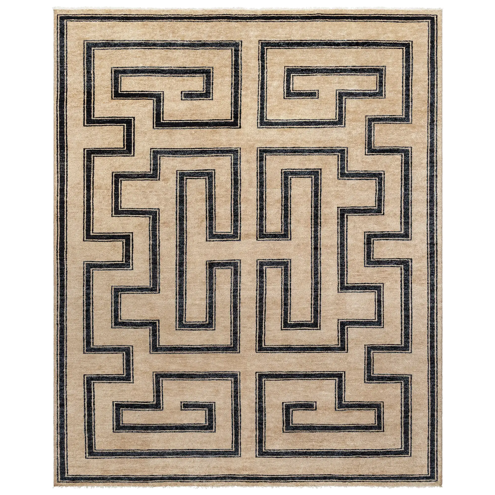 Lemieux et Cie Marquise Noire Handmade Wool Rug in black and tan, hand-knotted geometric Greek key pattern, shown on white studio backdrop.