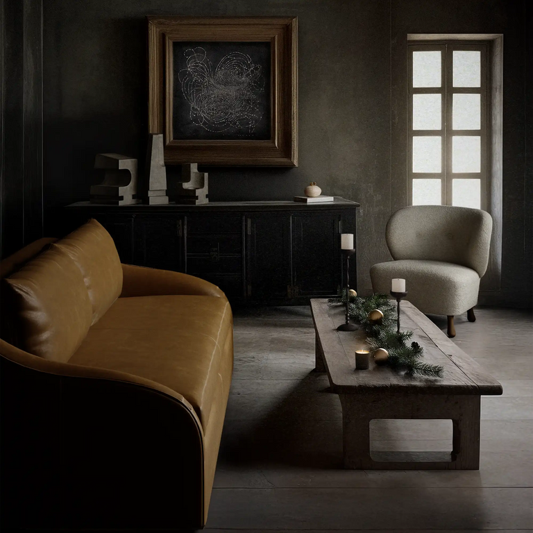 Lemieux Et Cie Brown Rousseau Leather Sofa, Lemieux Et Cie Tourenne Chair, Lemieux Et Cie Achille Candle Holder Collection, Lemieux Et Cie La Structure Sculptures, and Lemieux Et Cie Les Étoiles Limited Edition Art Print in a dark living room.