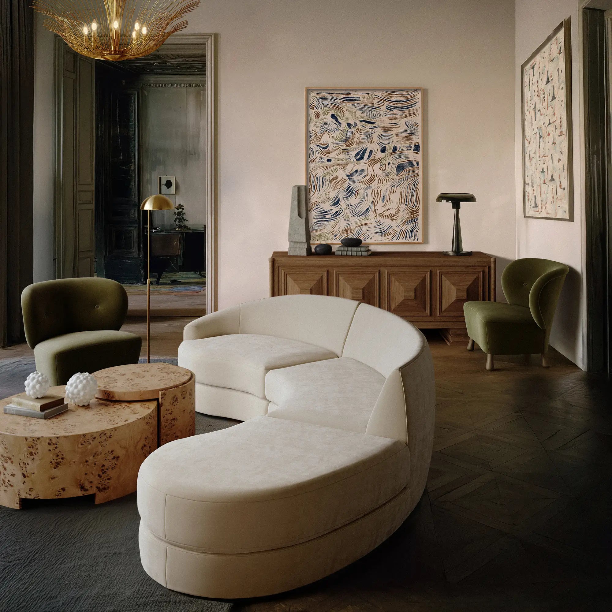 Lemieux et Cie Rondel Bunching Cocktail Table in blonde mappa burl, drum-shaped coffee table styled in a neutral sitting room with dark wood floors.
