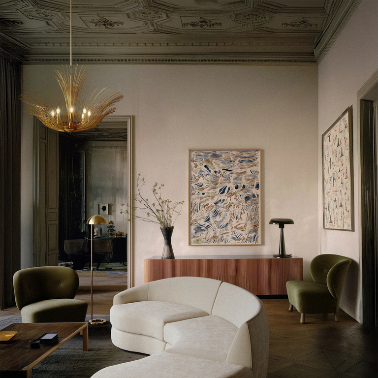 Lemieux et Cie Dorelle Chandelier, sculptural starburst form with radiating arms, suspended in a grand sitting room with ornate plaster ceiling and wood floors.
