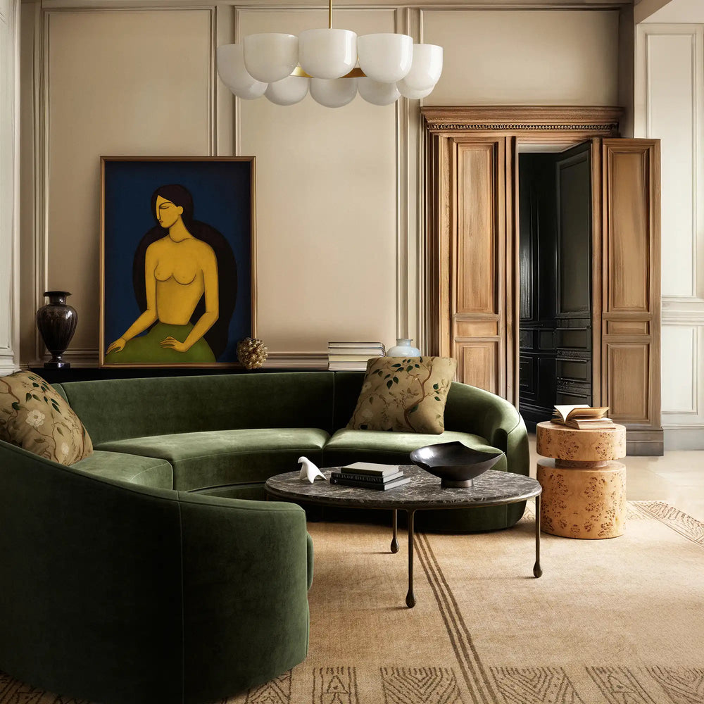 Lemieux et Cie Les Femmes fine art print, botanical motif pillow, displayed in a sitting room with paneled walls and green sofa.