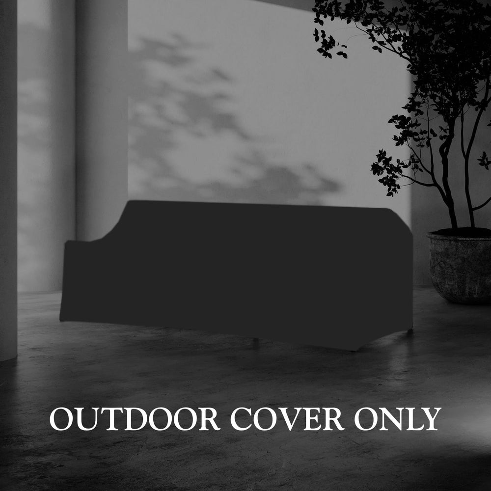 Lemieux et Cie Hudson 3-Seat Sofa Outdoor Cover in dark gray, protective furniture cover shown on stone floor near potted tree and white walls.