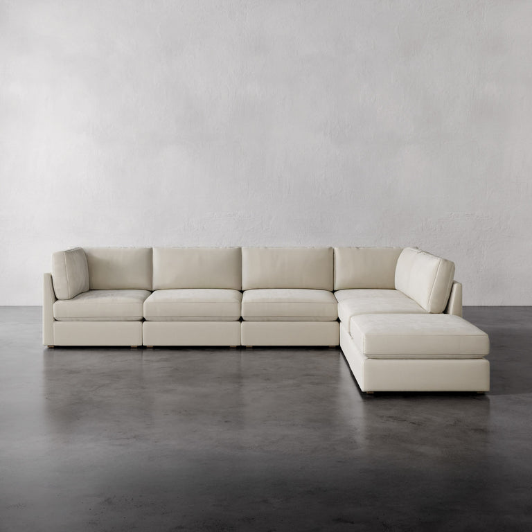 Lemieux Et Cie Chanaux 6-Pc Sectional
Beige sectional sofa on a gray floor with a plain gray wall background