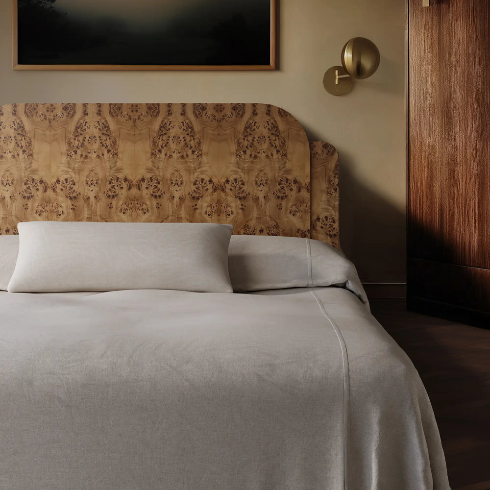 Lemieux et Cie soft white heavy linen pillow cover and coverlet on the burl wood avenir bed