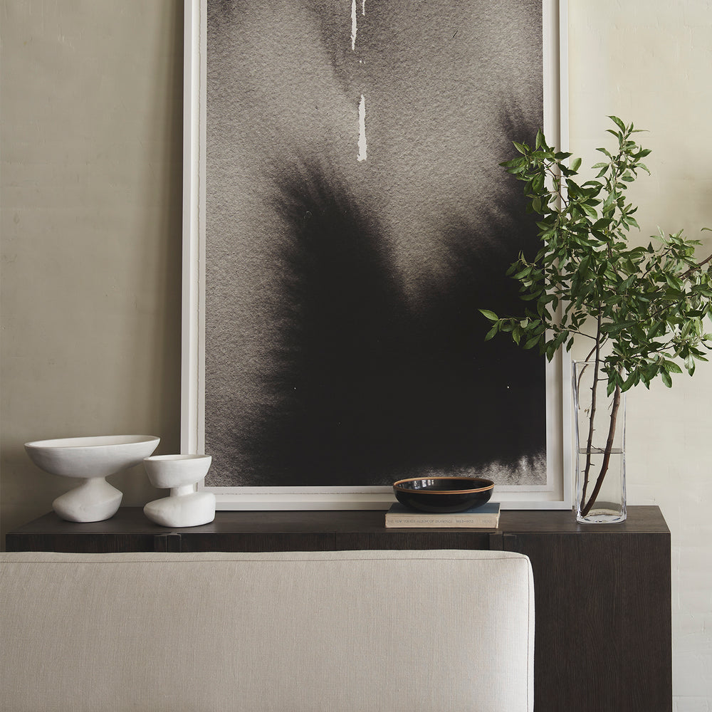 Lemieux et Cie Matili Organic Bowl in white cement, sculptural vessel, styled on dark console with neutral walls and framed artwork.