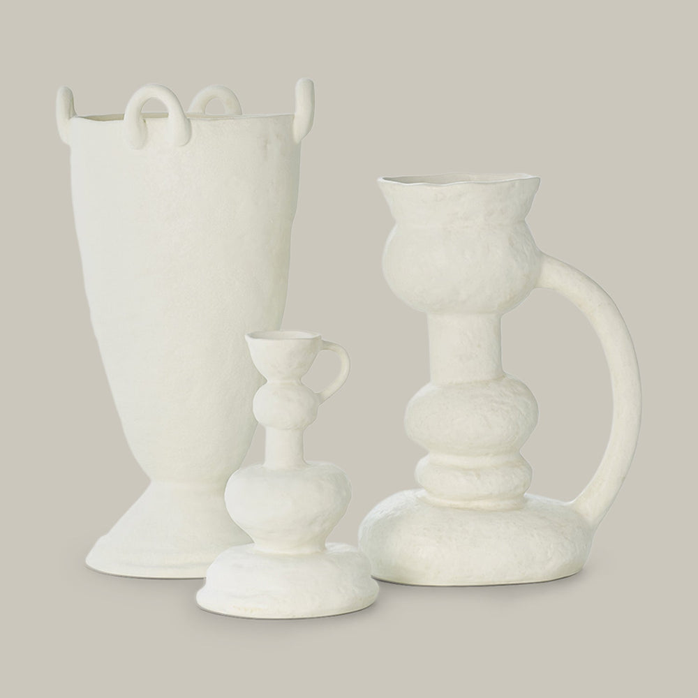 Lemieux et Cie Victoire Vase in white, sculptural ceramic vessel with organic stacked form and curved handle, shown on neutral backdrop.