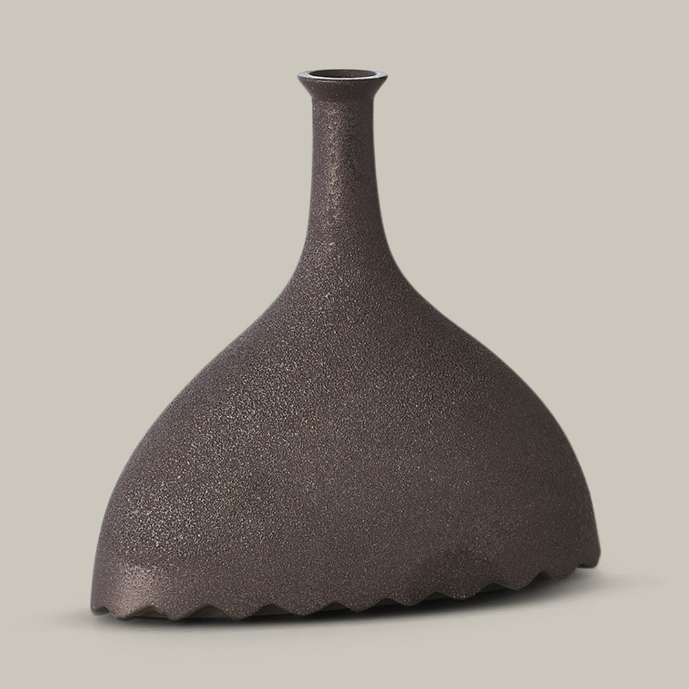 Lemieux et Cie Noelle Geometric Vase in black, sculptural vessel with fluted base and narrow neck, shown on neutral backdrop.