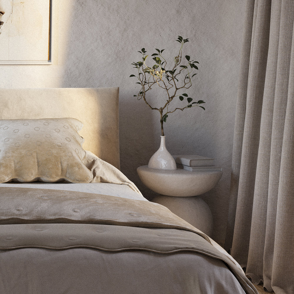 Lemieux et Cie Noelle Geometric Vase in white, sculptural vessel with fluted base, styled bedside with branch on neutral curved nightstand.