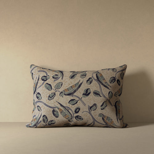 Linen accent pillow with French bird and botanical pattern in indigo, teal, and hazelnut on natural flax ground
